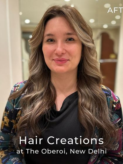 The beautiful after-shot of a cool ash colour transformation. The long layers and Hollywood waves perfectly complement the new, sophisticated shade.