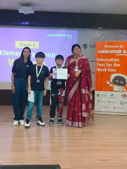 Team Track Guard receiving their gold medal at the Codeavour 6.0 Nationals. Their project was judged the best in the elementary category.
