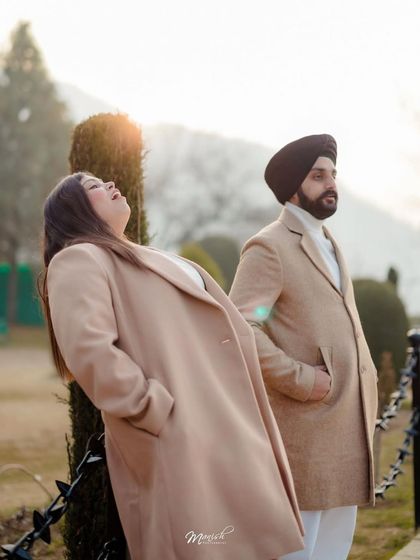 A candid moment of laughter, capturing the pure joy and fun of their relationship during their Kashmir pre-wedding shoot.