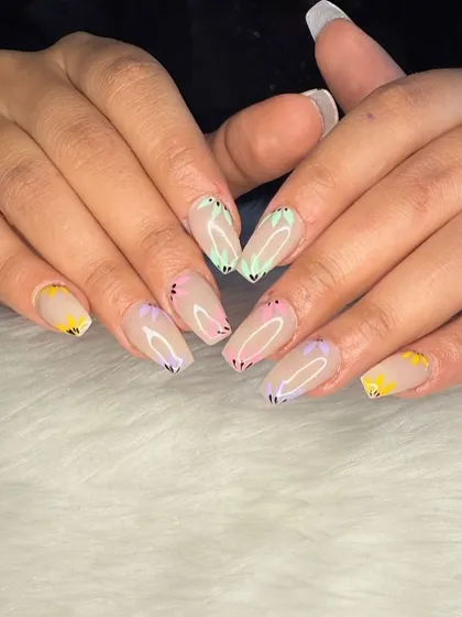 A full view of the fun and whimsical butterfly wing manicure.