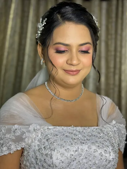 A close-up of Aldina's makeup, showcasing the beautiful blend of pink tones on her eyes.