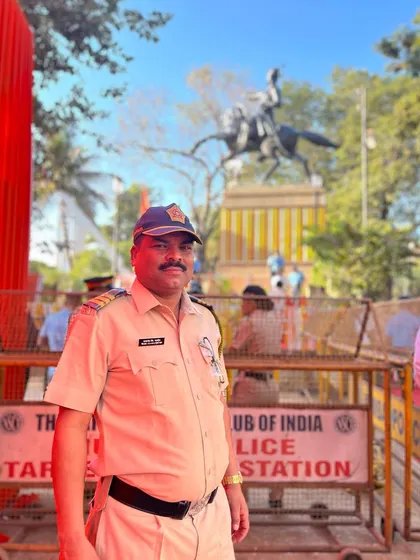A portrait of a Mumbai Police officer on duty during Shiv Jayanti celebrations. This image honors the people who work to ensure our festivals are safe and successful.