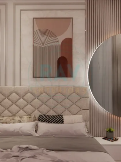 A close-up of a bedroom headboard, featuring a combination of a quilted panel, vertical wood slats, and a backlit circular mirror.
