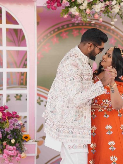 The first dance as a soon-to-be-married couple. The colorful and artistic Mehandi stage provides a lively and beautiful setting for their celebration.