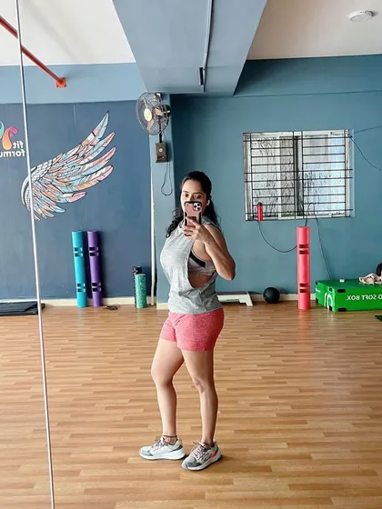 A mirror selfie capturing the results of hard work and dedication. Our studio provides the perfect backdrop for your fitness journey.