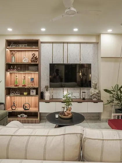 Another view of the living room from image 22, showing the swing and illuminated display shelf.