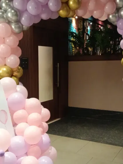 A welcome sign and balloon arrangement at the entrance for Kavya's 10th birthday party.
