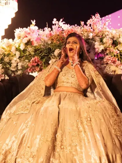 The pure, unfiltered joy of a sangeet night. This candid shot of the bride is one of my favorites, capturing the fun and energy of the event.