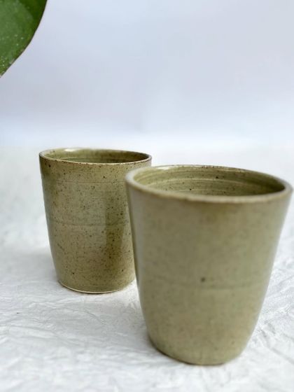 A pair of Green Celadon tumblers, showing their simple and elegant form.