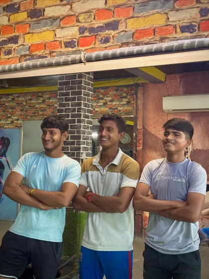 A moment of relaxation after a hard workout. The smiles show the satisfaction of pushing their limits.