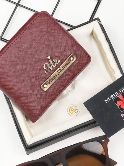 A personalized maroon wallet with a 'Mr.' charm, showcasing a classic and popular color choice.