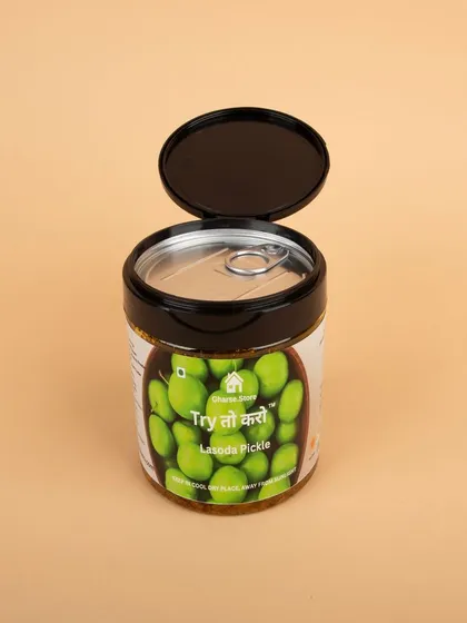 The Lasoda Pickle jar with its lid open, showing the pull-tab for freshness.