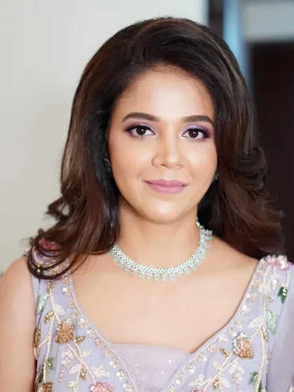 Nilofar's finished engagement look. The combination of shimmering eyes, defined brows, and a soft lip color creates a harmonious and stunning result.