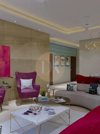 A vibrant living room from a Gurgaon apartment, where a golden fluted glass backdrop creates a stunning focal point. The design mixes bold colors like magenta with luxurious textures for a contemporary and opulent feel.