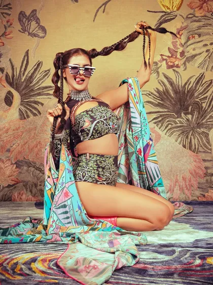 A playful shot showing how the makeup and hair work with accessories to create a cohesive and interesting character for the editorial.