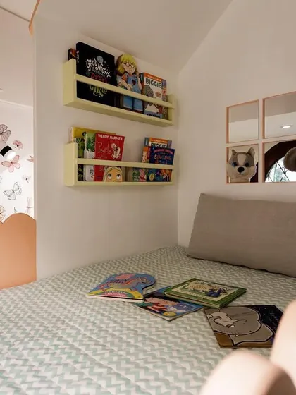 Creating dedicated spaces for quiet time is so important. This cozy reading nook, tucked away in a custom-built playhouse, is the perfect spot for a child to get lost in books and stories.