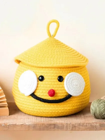 A full view of the smiley face rope basket, a perfect and affordable storage and gifting option.