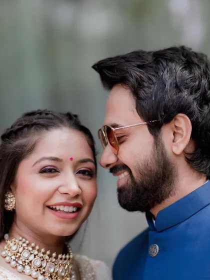 A sweet, romantic close-up of the couple. The bride's simple hairstyle keeps the focus on her happy expression.