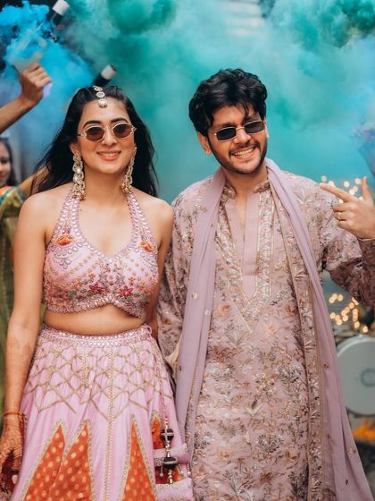 A fun and vibrant shot with color smoke in the background. This shows how we can incorporate playful elements to create dynamic and memorable photos.