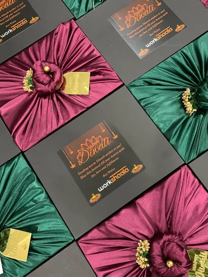 For this corporate order for Workshaala, I combined elegant black boxes with rich satin-wrapped gifts inside. Each box was finished with a custom-branded Diwali card, creating a sophisticated and memorable gift for their team.