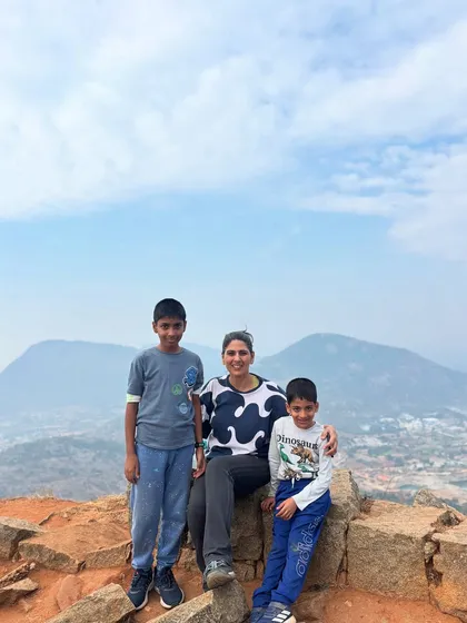 A mother with her two sons at a scenic viewpoint during a family trek. Our adventures are designed to help families bond and create cherished memories in the great outdoors.