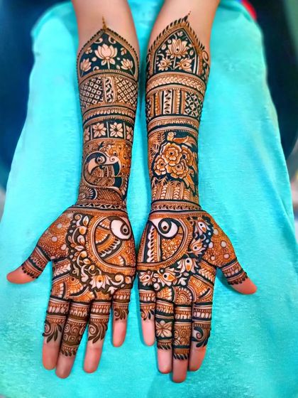 A lovely design with peacocks, lotuses, and roses, perfect for a bride who loves floral and bird motifs.