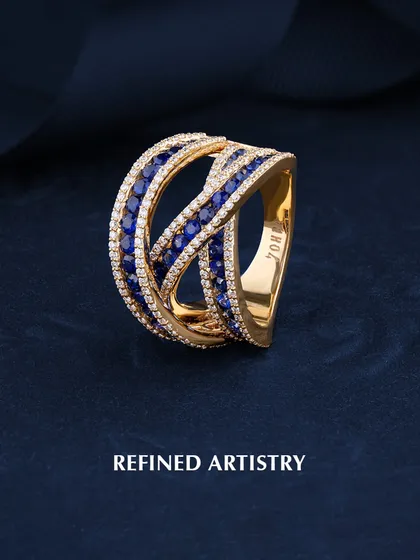 Refined artistry in every curve. This interwoven ring is crafted with bands of deep blue sapphires and sparkling diamonds, creating a design that is both bold and elegant. The "ZOHRA" mark inside the band is my guarantee of quality.