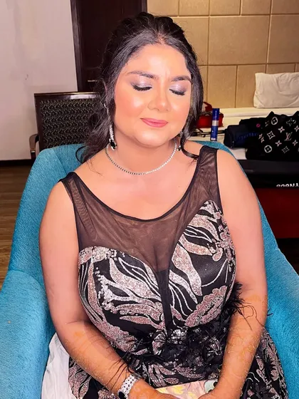 A close-up of the soft, shimmery eye makeup that adds a touch of sparkle to this elegant cocktail look.