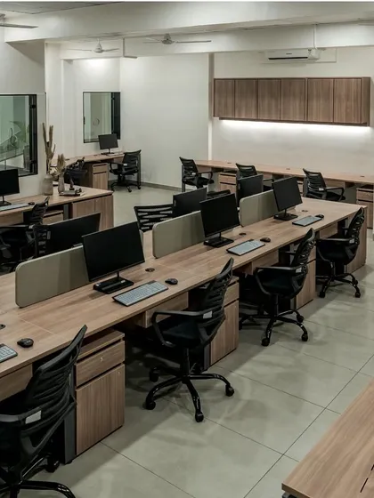 A look at a corporate office I designed. The open-plan layout features clean lines and a minimalist aesthetic, with wooden desks and ergonomic chairs to create a functional and collaborative workspace.