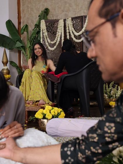 A candid moment during the mehendi application. I love creating spaces where family members can relax and be part of the celebration, like this father getting his own henna design.