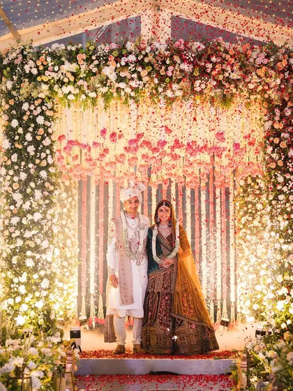 This is how you turn a plan B into the main event. For this monsoon wedding, we built a clear-top tent with a stunning floral mandap, ensuring the ceremony was magical, rain or shine.