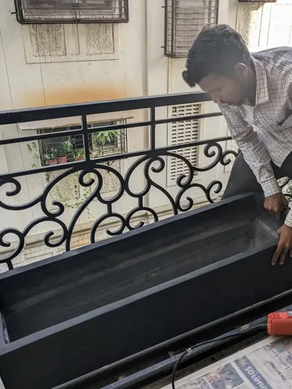 Here I am installing a custom-sized rectangular FRP planter on a client's balcony. These planters are perfect for creating privacy screens or for gardening in narrow spaces.