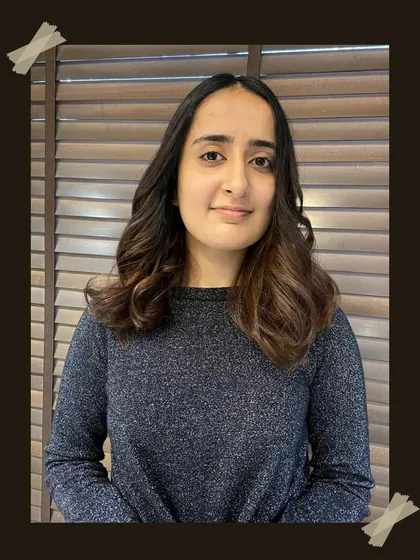 The client is all smiles with her new balayage. The soft, face-framing highlights and gentle waves create a fresh and modern look.