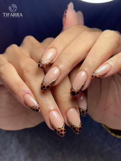 A full view of the fierce and feminine leopard print French tip extensions, perfect for making a statement.
