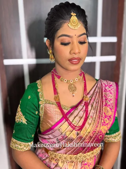 A portrait of the pink and green half-saree look, with eyes closed to show the soft, blended eyeshadow.