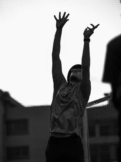 A black and white silhouette of me setting the ball, capturing the motion and energy of the play.