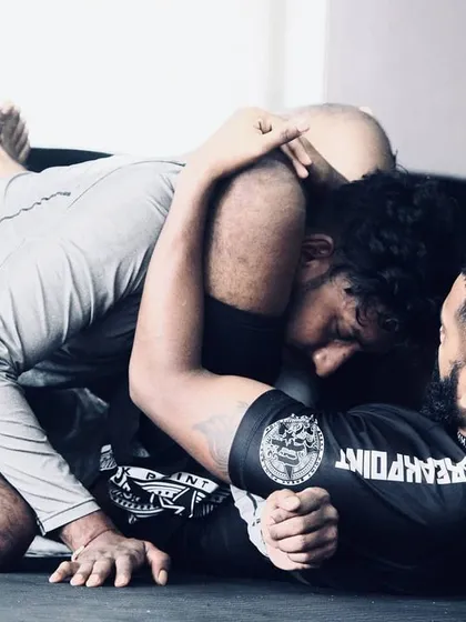 A great shot from a BJJ rolling session. This shows the intensity and focus required in grappling. We constantly work on winning these small moments, improving our position, and looking for the submission.