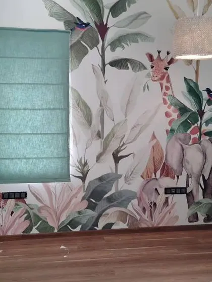 For this kid's room, I fitted a green fabric Roman blind that complements the jungle-themed wallpaper. This is a good example of how I coordinate window treatments with your room's decor.