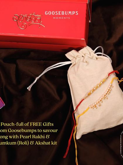 Here's a closer look at the essentials that accompany the 'Nok Jhok' hamper. The pouch contains a Pearl Rakhi and a traditional Roli and Akshat kit for the ceremony.