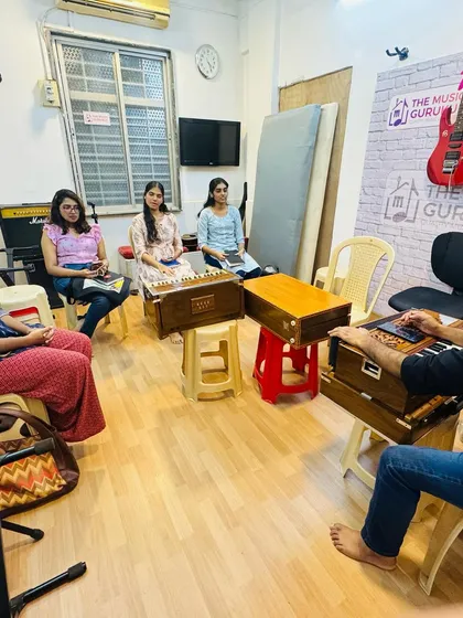 A wide view of our Hindustani vocal class in session. The setup with harmoniums and focused students reflects our commitment to providing an authentic and effective learning experience.