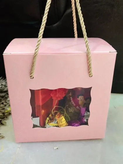A still image of the pink two-jar window box, a simple and sweet Rakhi gift.