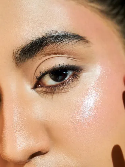 A macro shot showing the detail of our skin work. You can see the texture of the skin through the makeup, which is the hallmark of a truly flawless application.