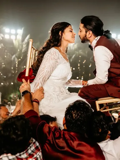 The energy of a Jewish wedding celebration is electric. Here, the bride and groom are lifted on chairs during the Hora dance, sharing a look of pure joy. I live for capturing these peak moments of celebration and tradition.