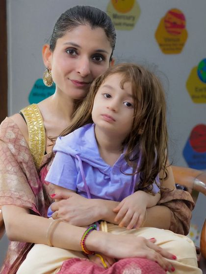 A warm and loving portrait of a mother holding her child. The comfort and safety in a mother's arms is a beautiful story to tell through photography.