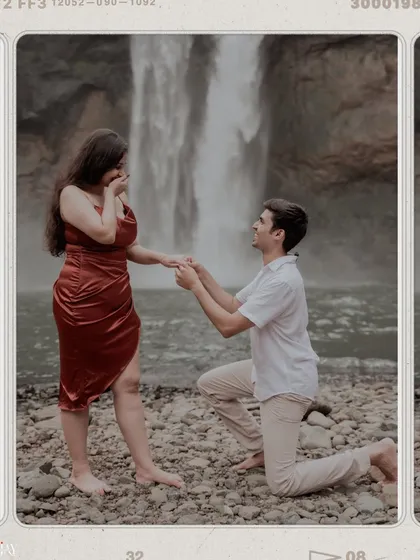 There's something magical about a proposal in nature. Here, against the backdrop of a powerful waterfall, he asked the most important question. This is a perfect example of a surprise proposal in a stunning, natural setting.