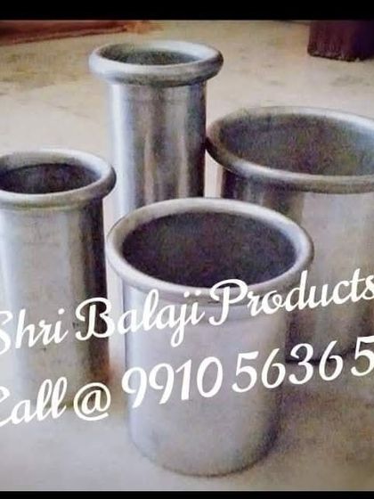 A collection of my sturdy aluminum pillar molds. These are a long-lasting investment for any serious candle maker, providing smooth, perfect pillars every time.