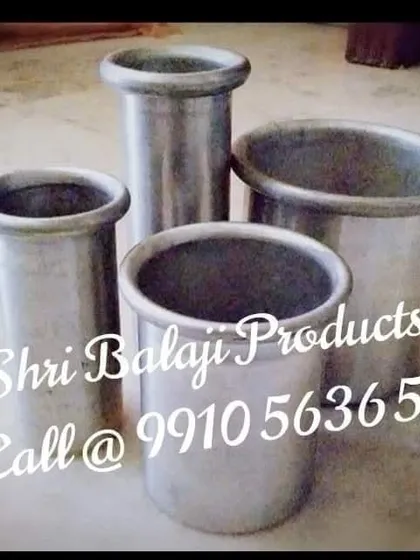 A collection of my sturdy aluminum pillar molds. These are a long-lasting investment for any serious candle maker, providing smooth, perfect pillars every time.