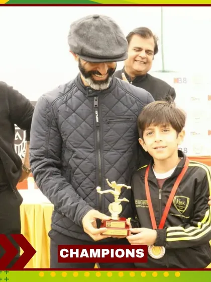 Another one of our players proudly holding his trophy after a successful tournament. These are the moments we work for.