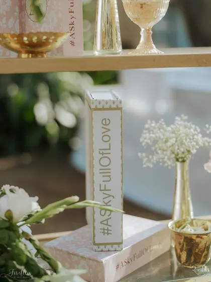 A decorative book prop featuring the couple's wedding hashtag, a simple yet effective way to personalize the space.