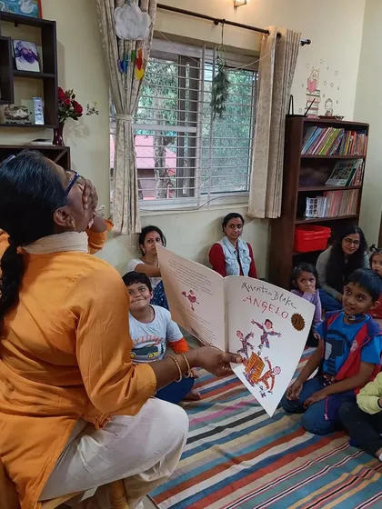 The storyteller's joy is evident as she shares the story of Angelo with an appreciative audience.
